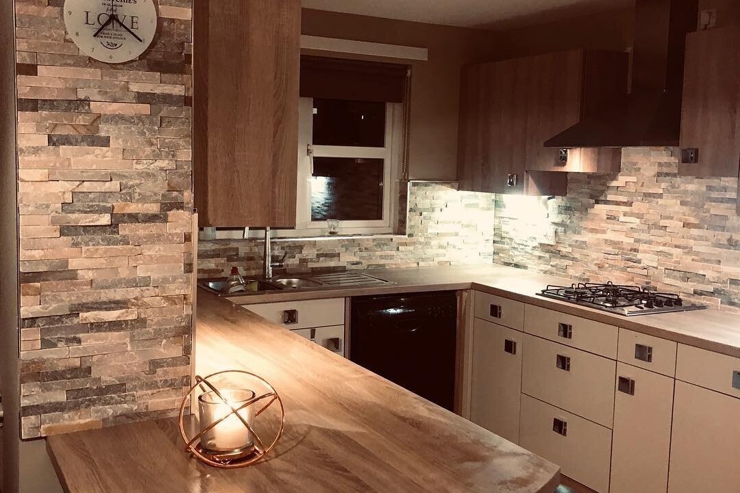 Cambuslang KitchenThis stunning job in Bardolino Oak wall cabinets and worktop with cashmere grey matte base cabinets beautiful extended breakfast bar